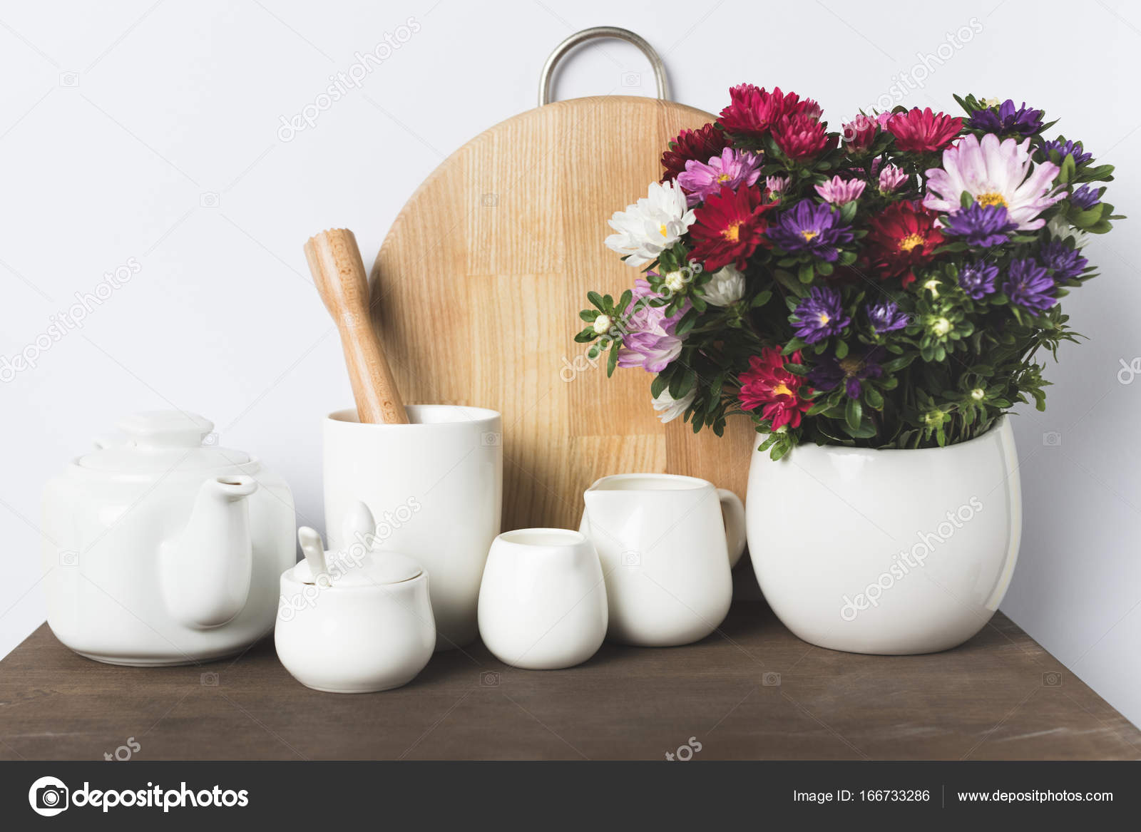 Kitchen utensils and flowers — Stock Photo © AntonMatyukha 166733286