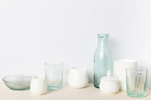 Empty glass and ceramic utensils — Stock Photo, Image