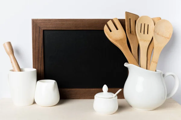Blank board and kitchen utensils — Stock Photo, Image