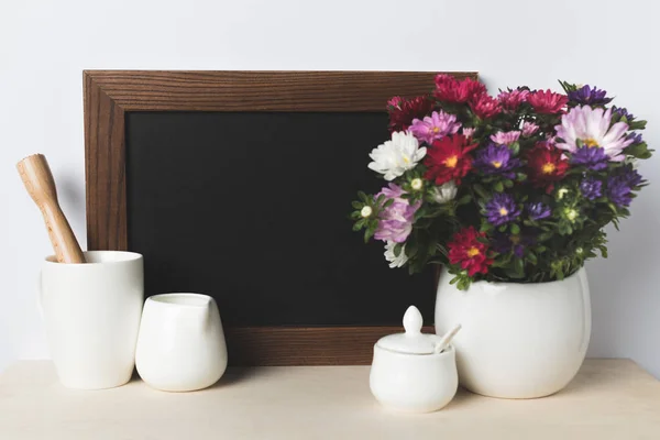 Blank board and kitchen utensils — Stock Photo, Image