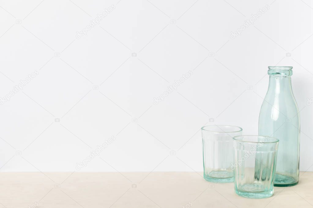 empty glass bottle and glasses