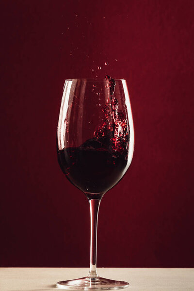 splash of wine in wineglass