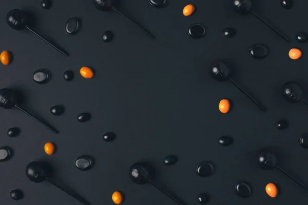 黑色和橙色的棒棒糖 — 图库照片