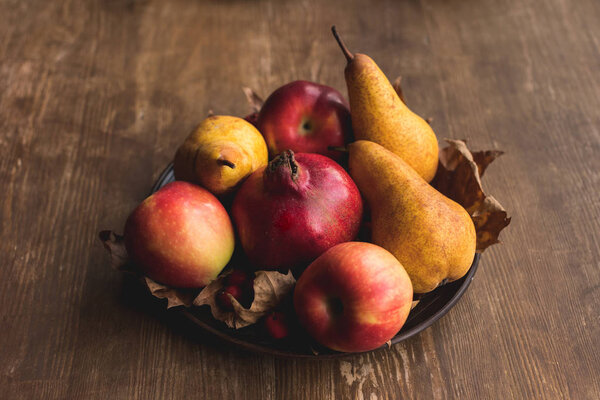 ripe autumn fruits on table