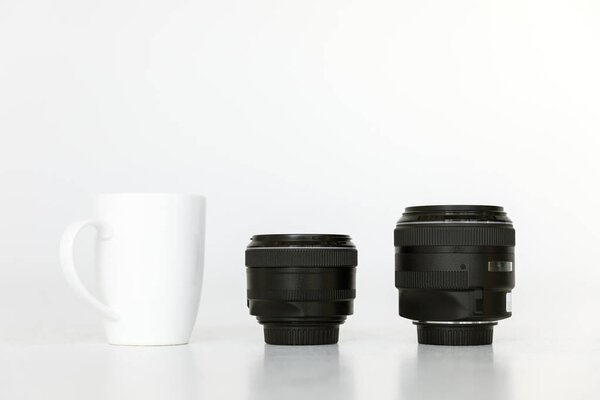 lenses and coffee mug