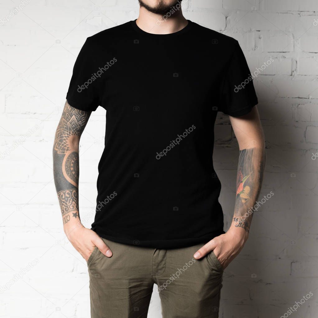 Cropped shot of man in blank black t-shirt