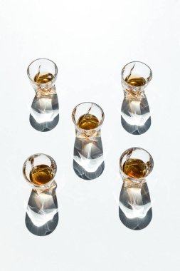 whiskey in glasses with shadows  clipart