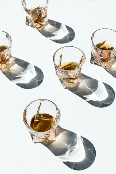 Whiskey in glasses with shadows — Stock Photo, Image