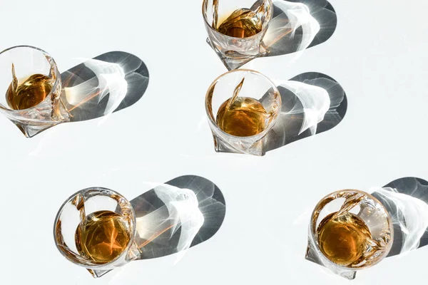 Bourbon in glasses with shadows — Stock Photo, Image