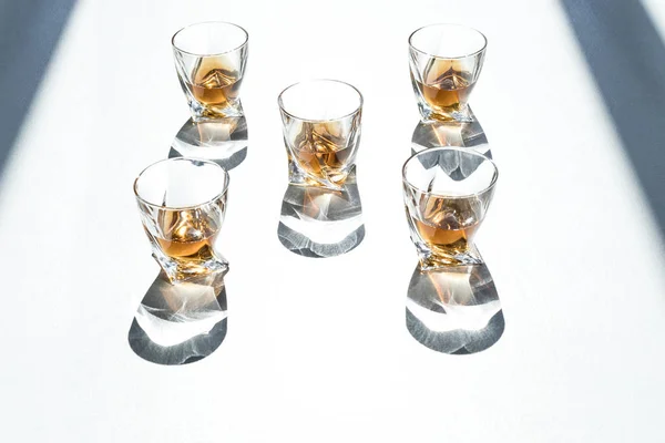 Whiskey in glasses with shadows — Stock Photo, Image