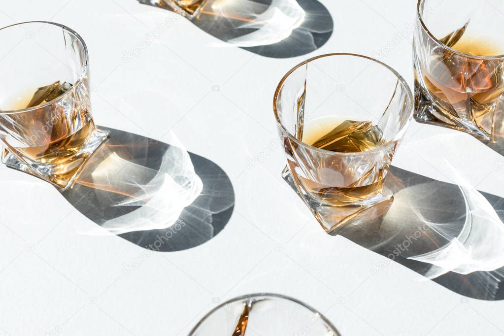 cognac in glasses with shadows    