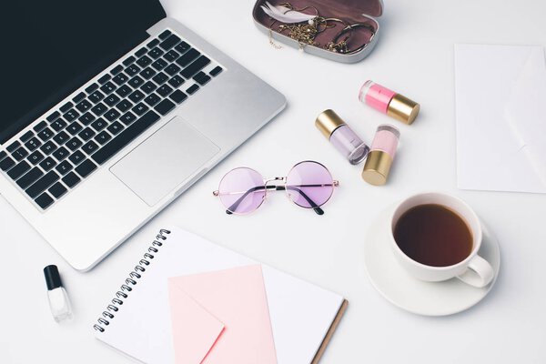 modern girly workplace with laptop