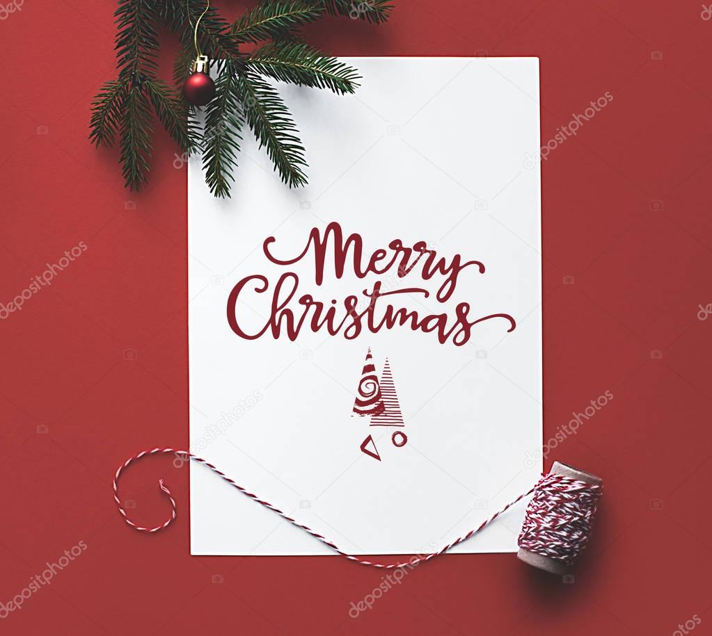 Christmas card with fir tree branch 