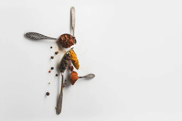 Spoons with various spices — Free Stock Photo