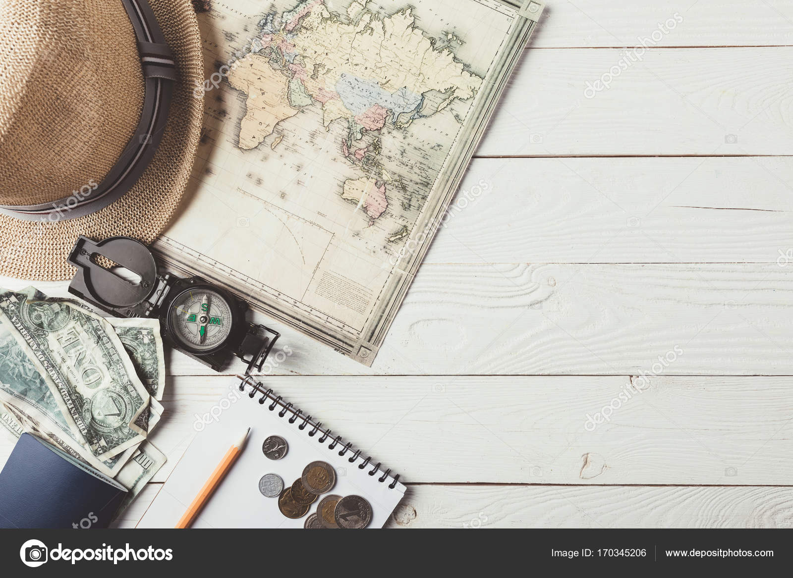 Travel stuff on white wooden table Stock Photo by ©AntonMatyukha 170345206