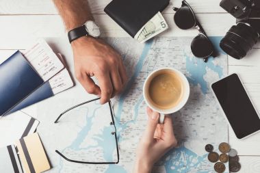 Couple planning travel with map