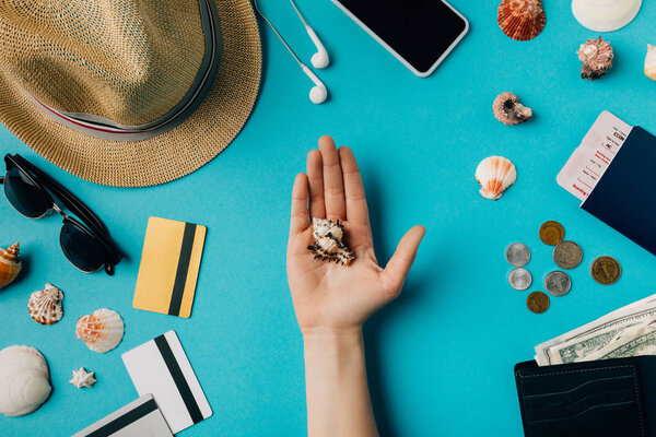 man holding seashell