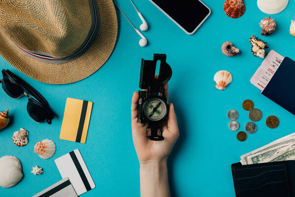 man holding a compass in hand