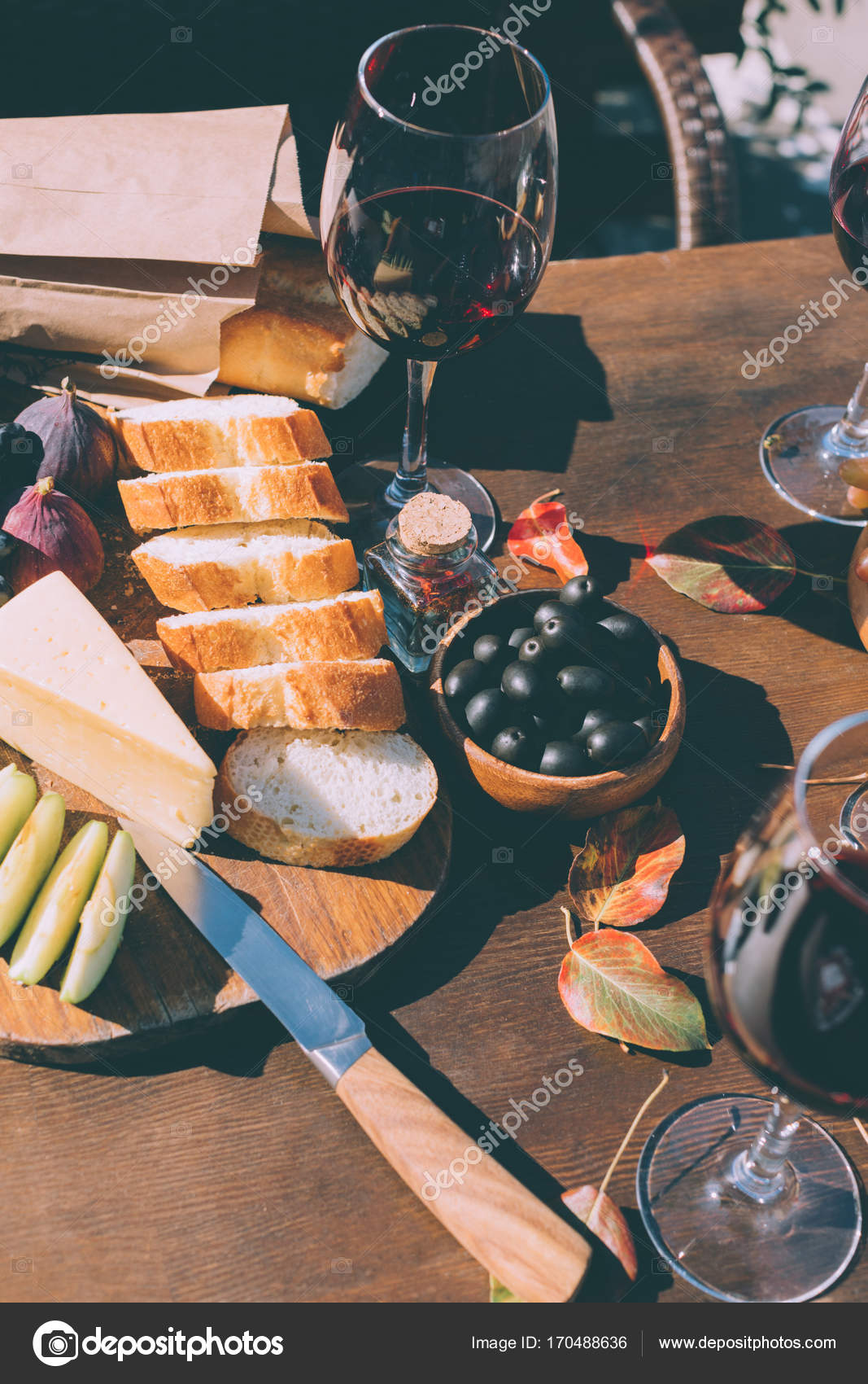 Red wine with various snacks — Stock Photo © AntonMatyukha 170488636