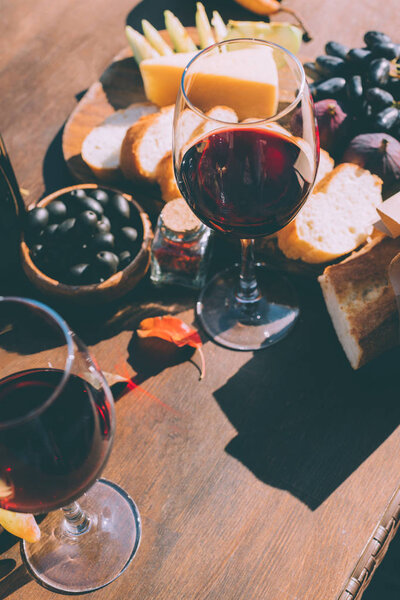 red wine with various snacks