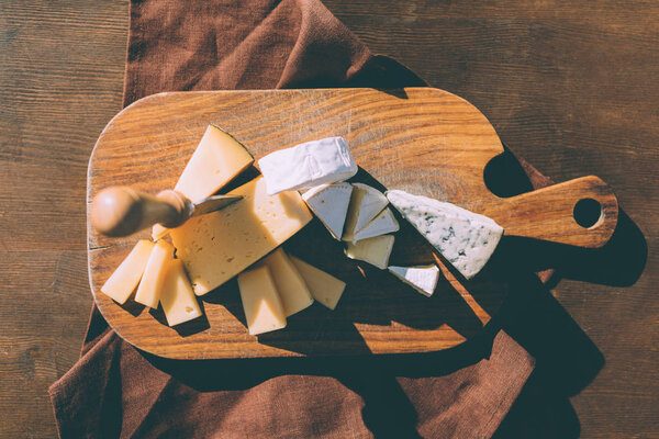 variation of cheese on cutting board