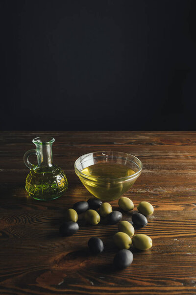 Glass bottle and bowl with olive oil