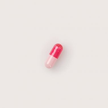 One red and pink pill