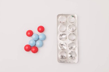 red and blue pills and blister pack
