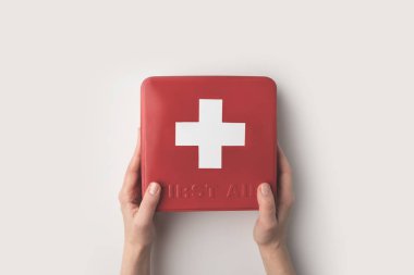 woman holding first-aid kit clipart