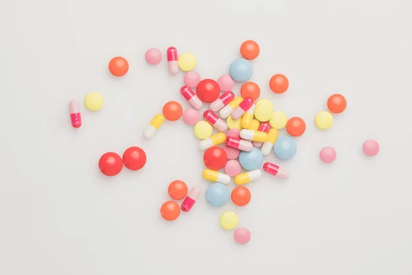 Scattered colored pills — Stock Photo, Image