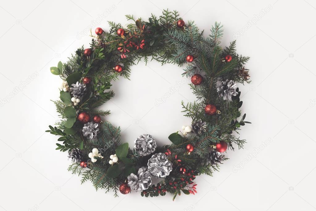 christmas wreath with balls and pine cones