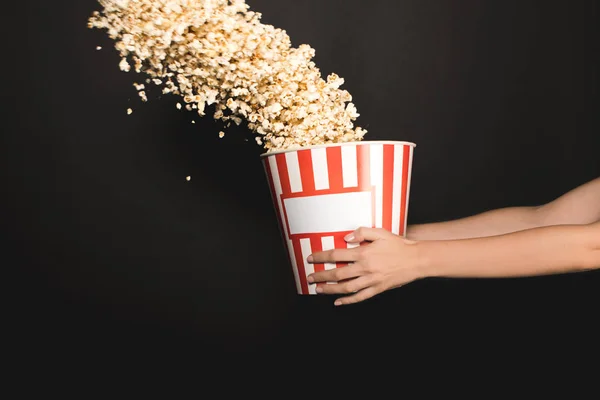 Woman holding bucket of popcorn — Stock Photo, Image