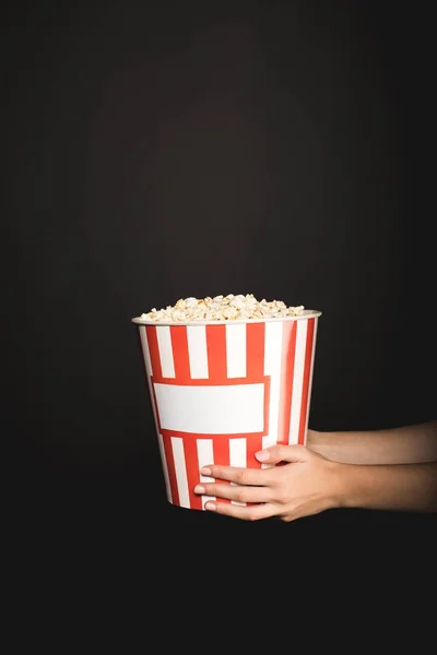 Woman holding bucket of popcorn — Stock Photo, Image