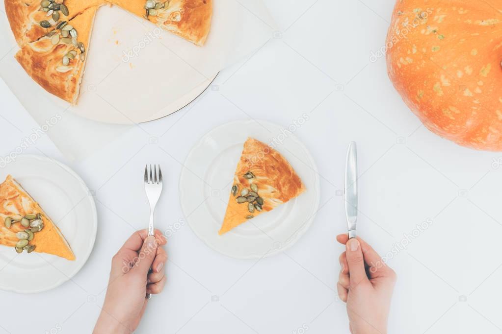 woman with slice of pumkin pie