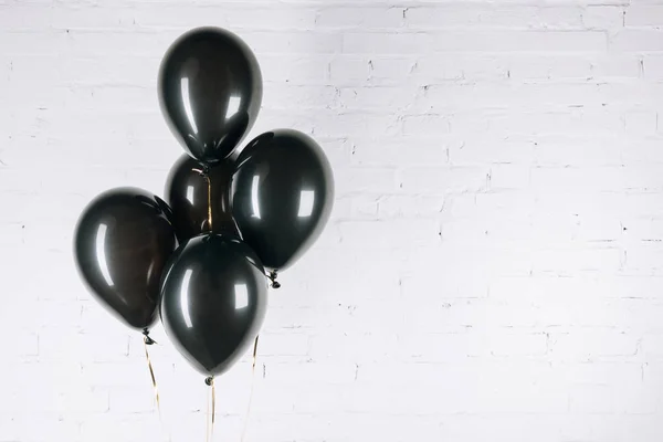 Shiny black balloons — Stock Photo, Image