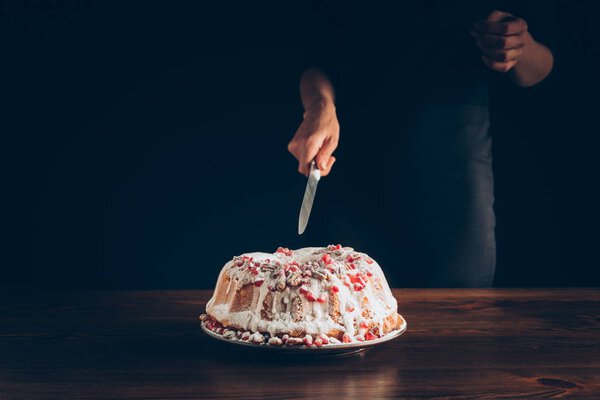 woman cutting traditional christmas cake
