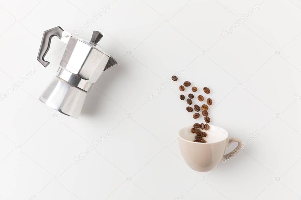 coffee beans pouring into cup