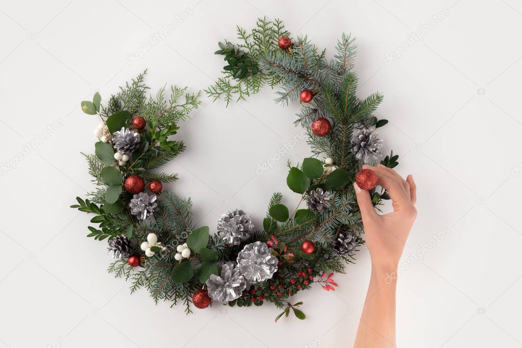 hand making christmas wreath 