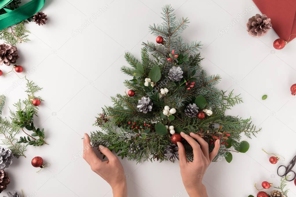 hand making christmas tree