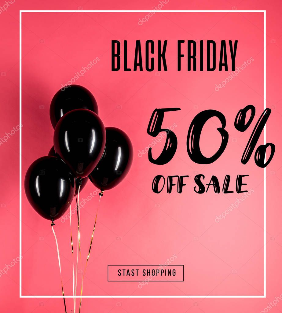 Pack of glossy black balloons isolated on red