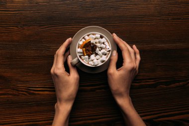 hands with cup of hot cacao clipart