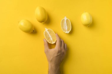 man holding half of lemon clipart