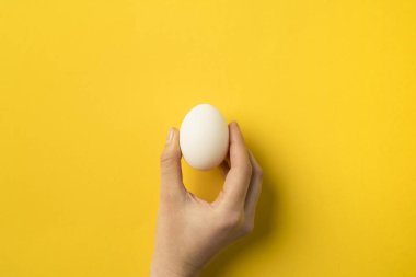 woman holding egg clipart