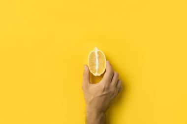 man holding half of lemon clipart