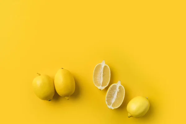 Cut and unprocessed lemons — Stock Photo, Image