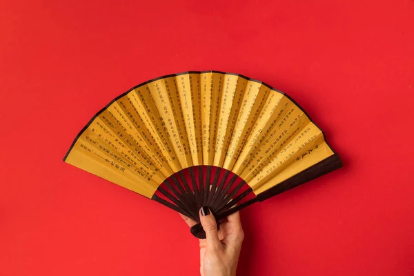 Oriental fan in hand — Stock Photo, Image