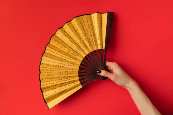 Oriental fan in hand — Stock Photo, Image