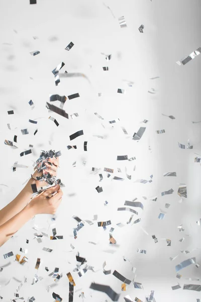 Woman catching falling confetti — Stock Photo, Image