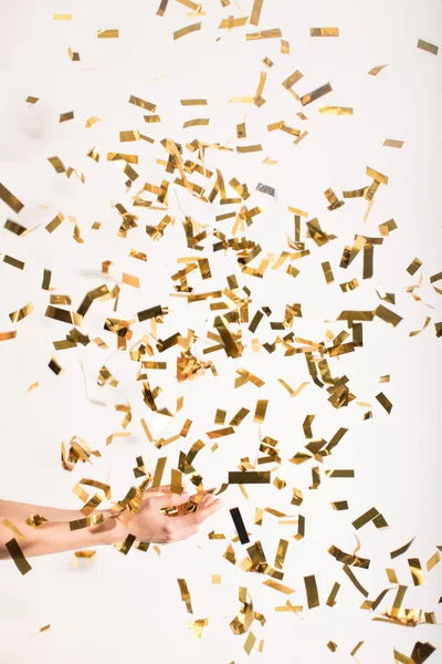 Woman catching falling confetti — Stock Photo, Image