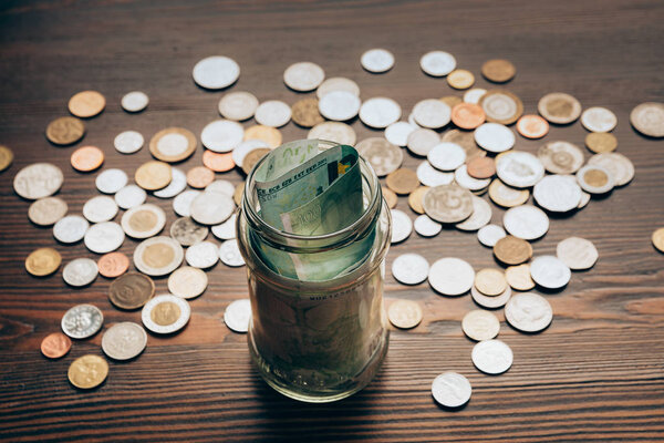 glass jar with banknotes 